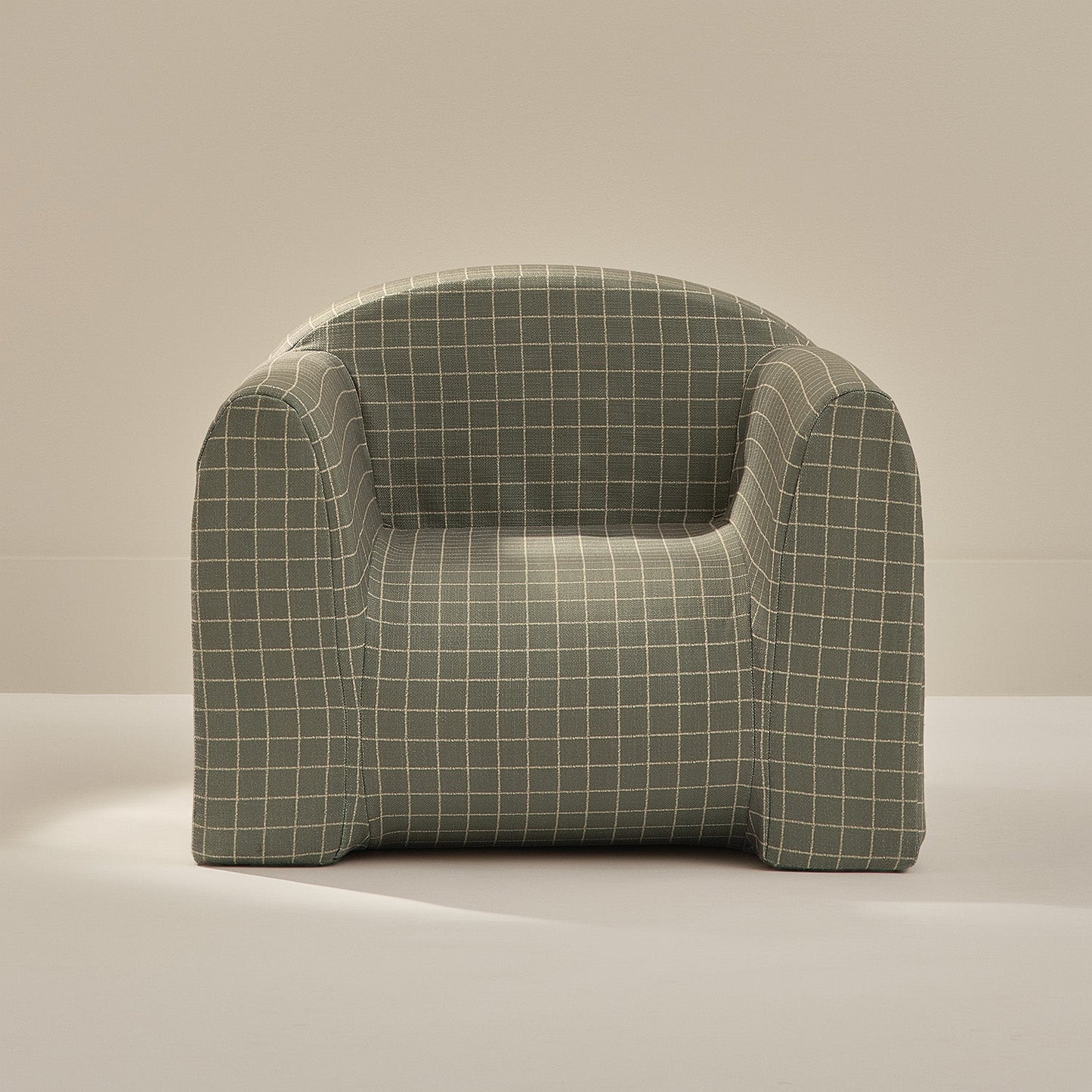 Plush armchair with grid pattern on a beige background