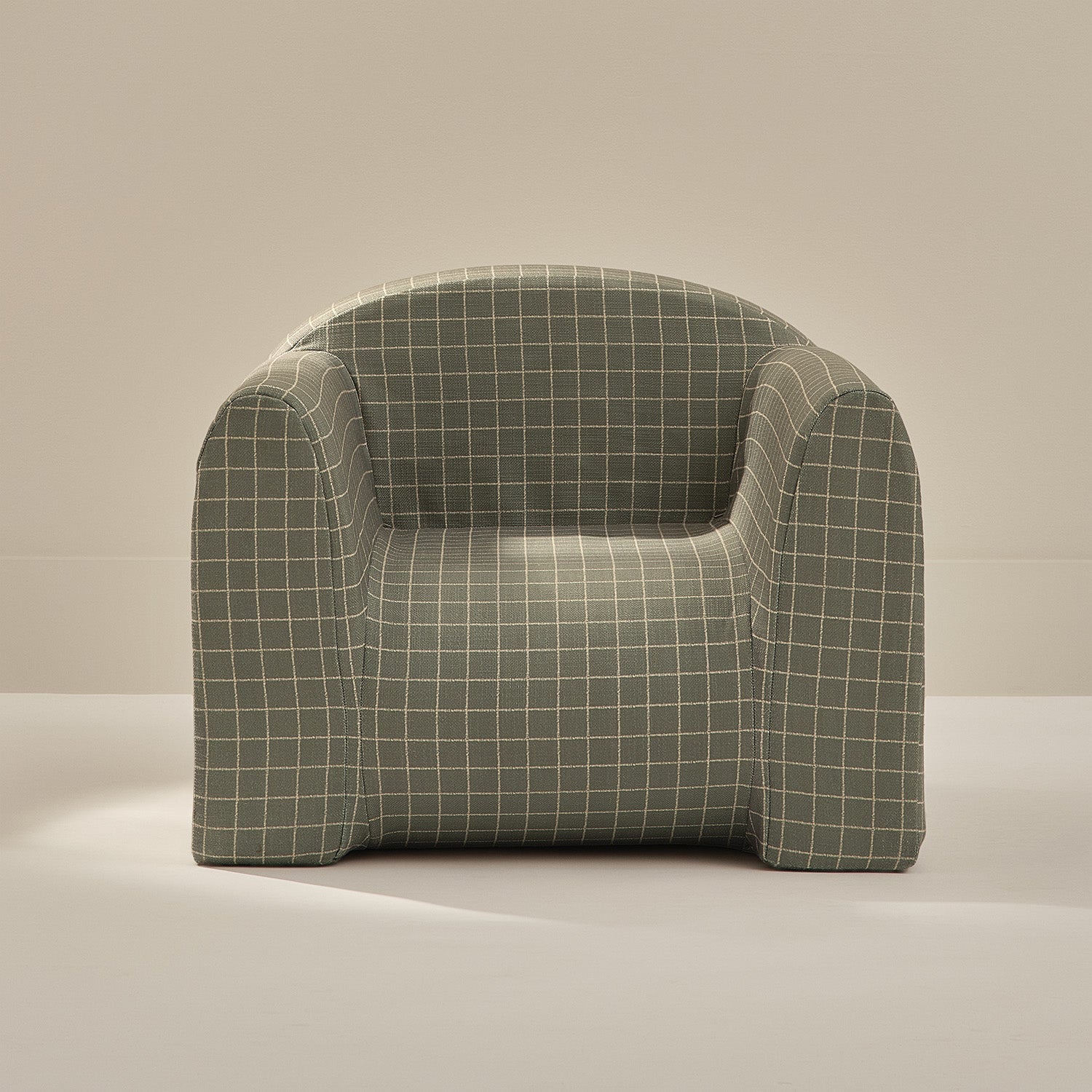 Plush armchair with grid pattern on a beige background