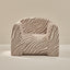 Zebra-patterned chair on a beige background