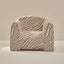 Zebra-patterned chair on a beige background