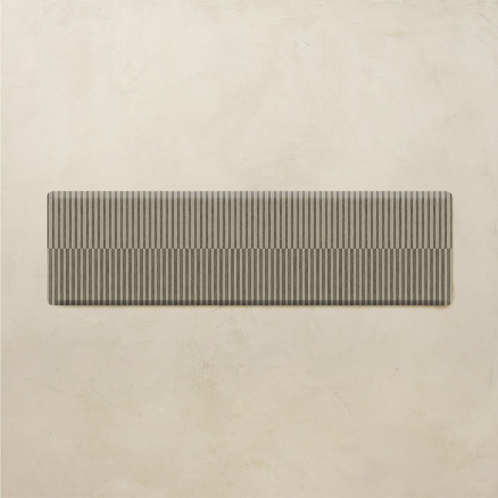 striped kitchen mat on a beige background