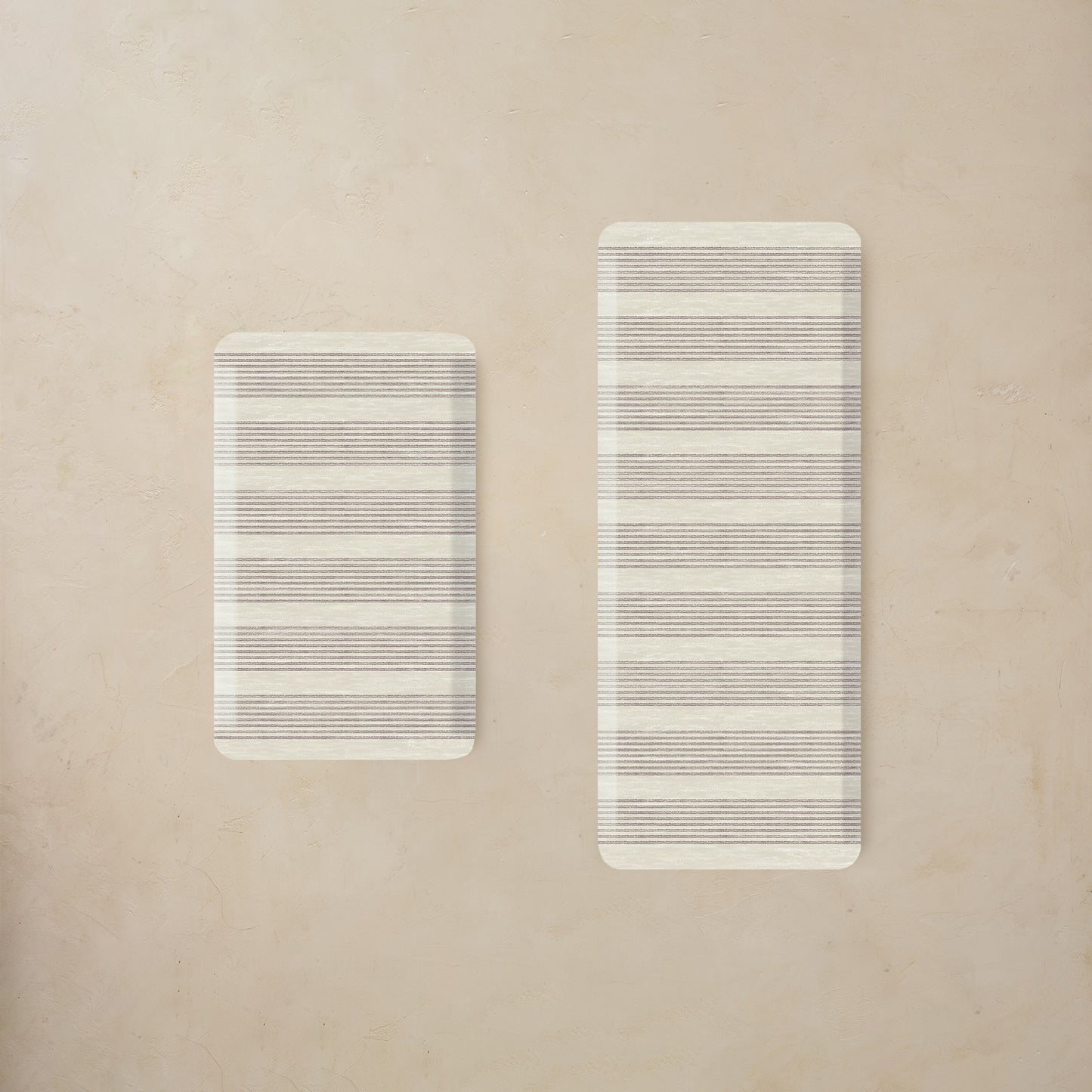 Two rectangular kitchen mats with striped pattern on a beige background