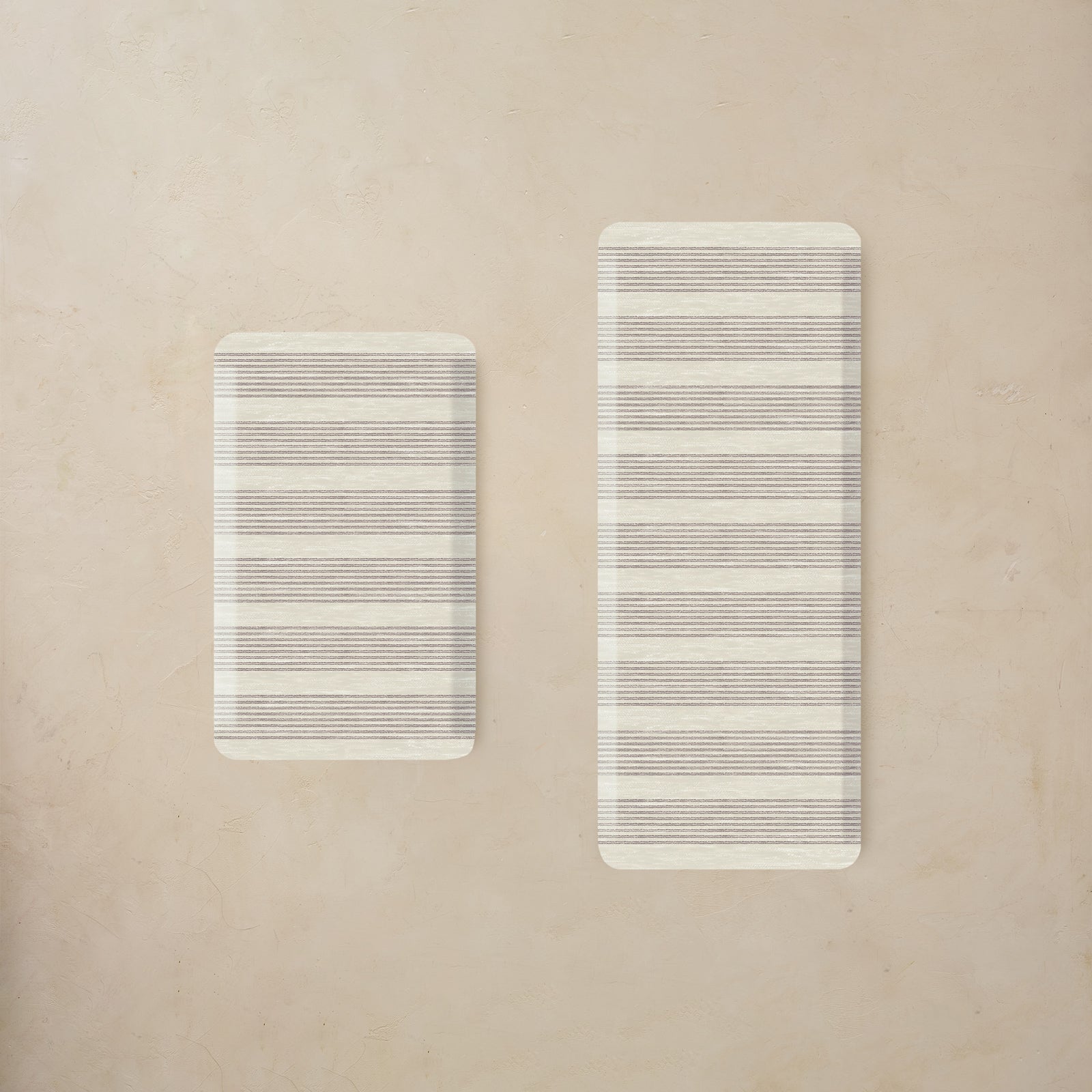 Two rectangular kitchen mats with striped pattern on a beige background