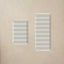 Two rectangular striped mats on a beige background