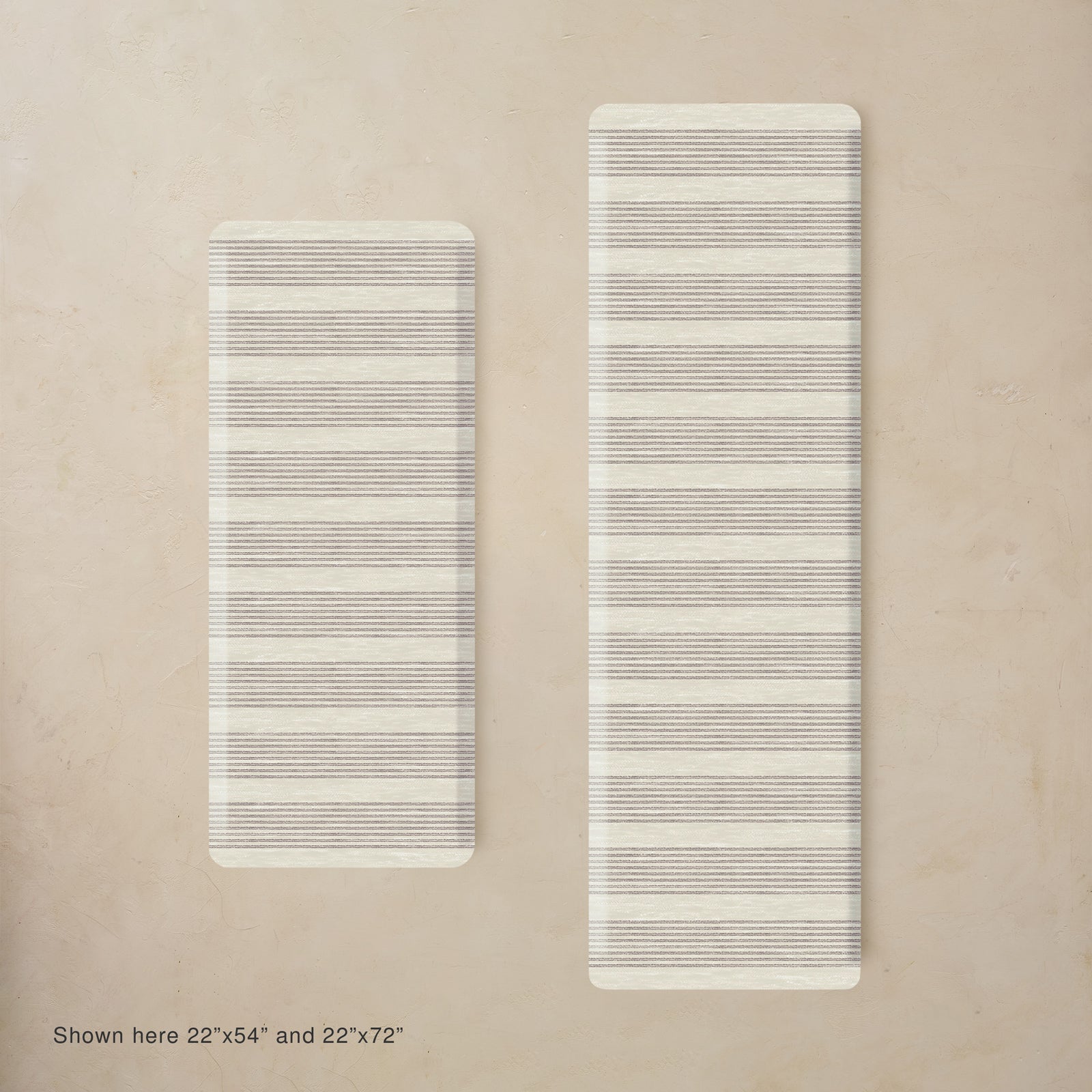 Two rectangular kitchen mats with striped pattern on a beige background