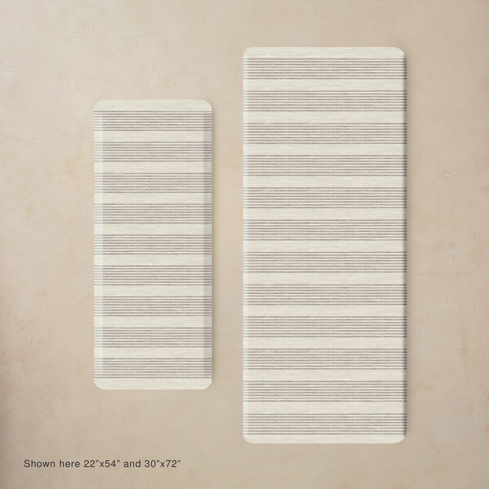 Two rectangular mats with striped patterns on a beige background