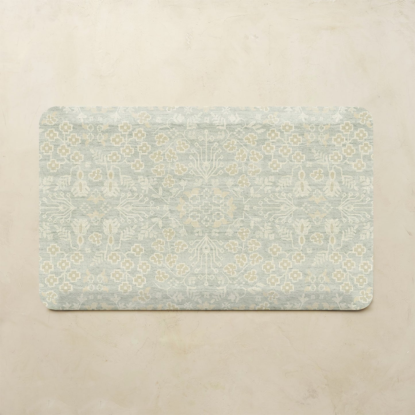 Decorative kitchen mat with floral pattern on a beige background