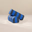 Two cylindrical armrest pillows with blue and dark gray horizontal stripes, displayed on a neutral beige surface.