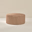 Striped ottoman with brown and beige pattern on a neutral background