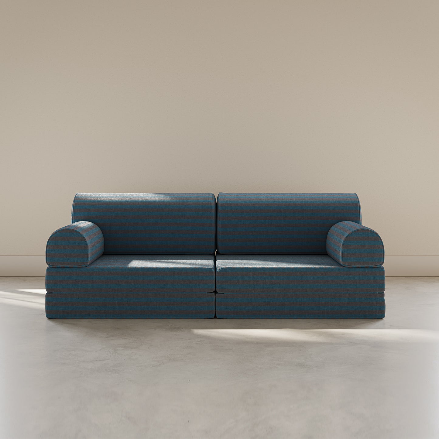 Blue modular sofa against a beige wall