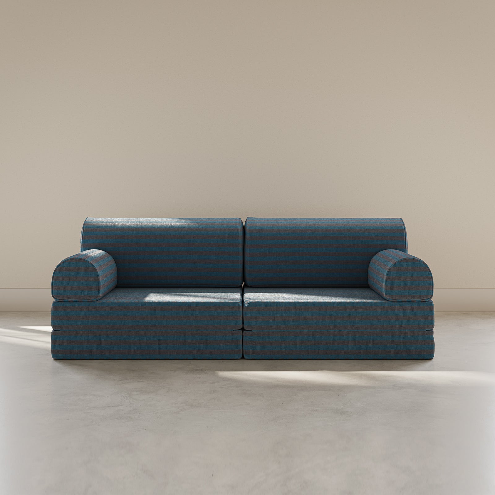 Blue modular sofa against a beige wall