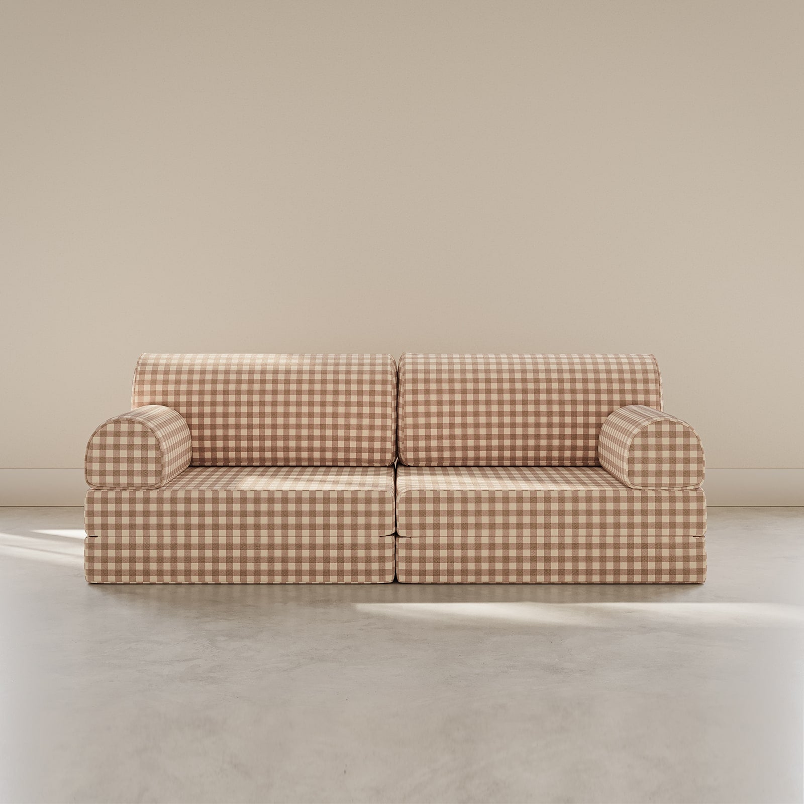 Beige checkered sofa against a beige wall