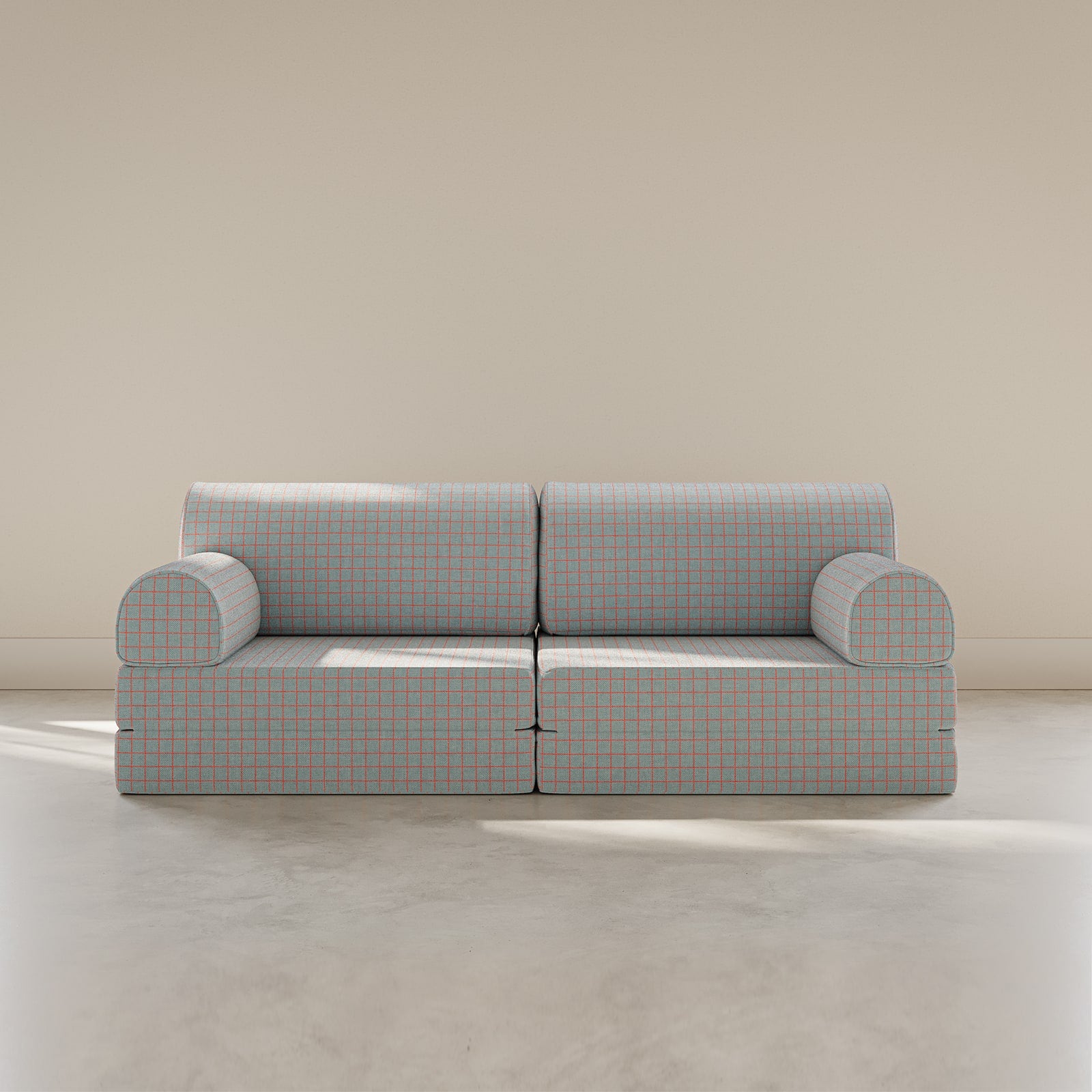 Modern blue sofa with a subtle pattern on a beige background