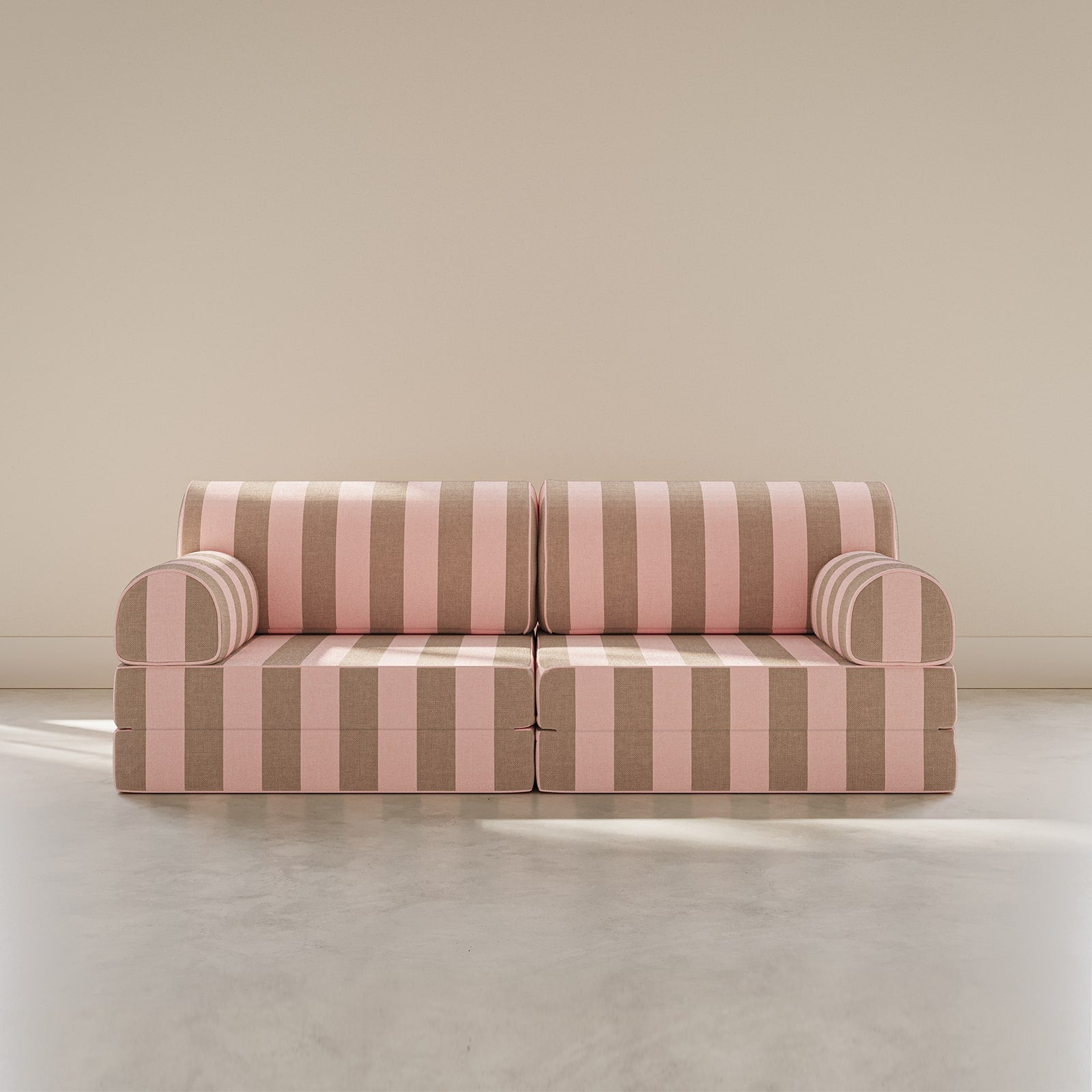 Striped sofa with pink and brown pattern on a plain background