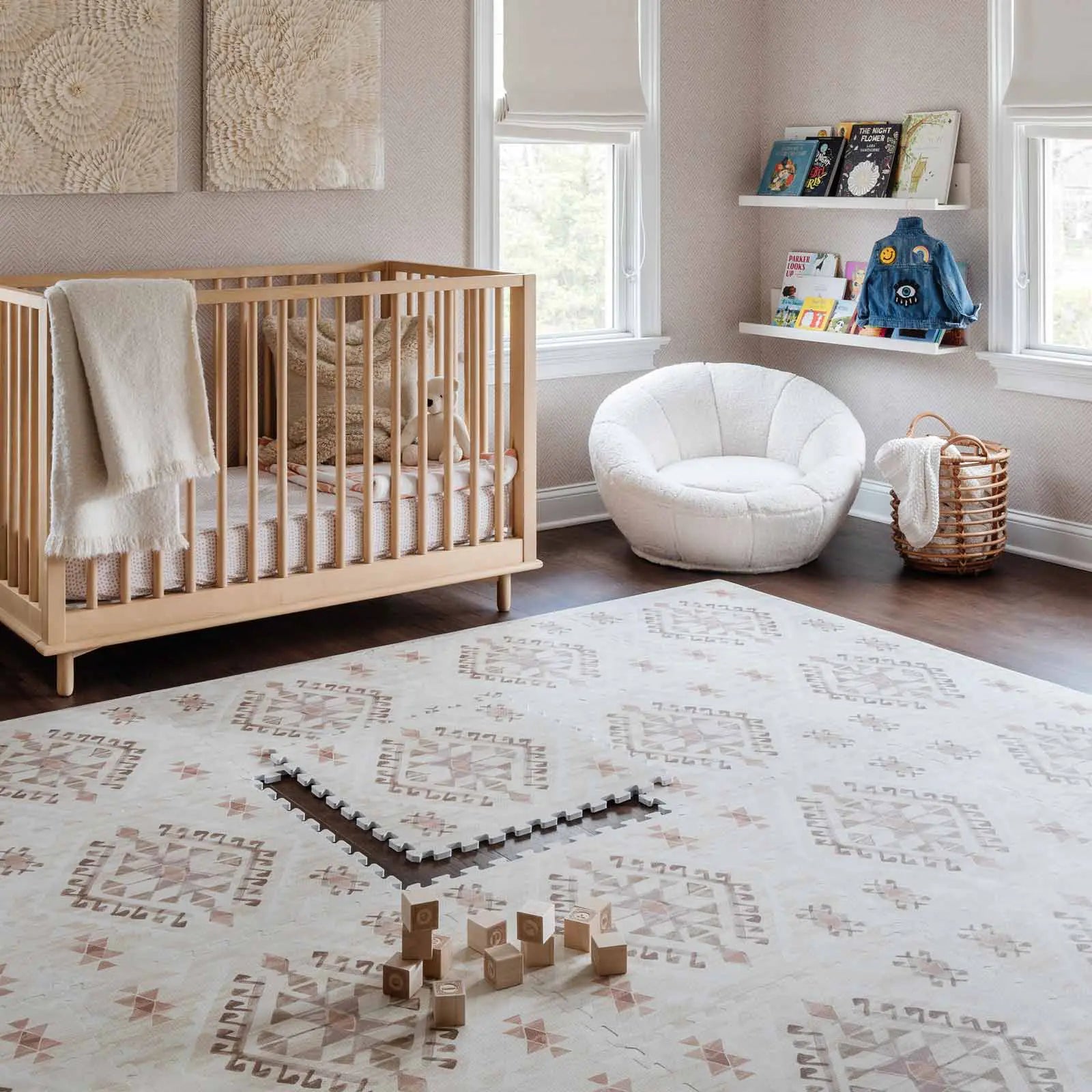 Nalla Mojave neutral beige brown and pink boho print play mat shown in nursery with wooden blocks on the mat