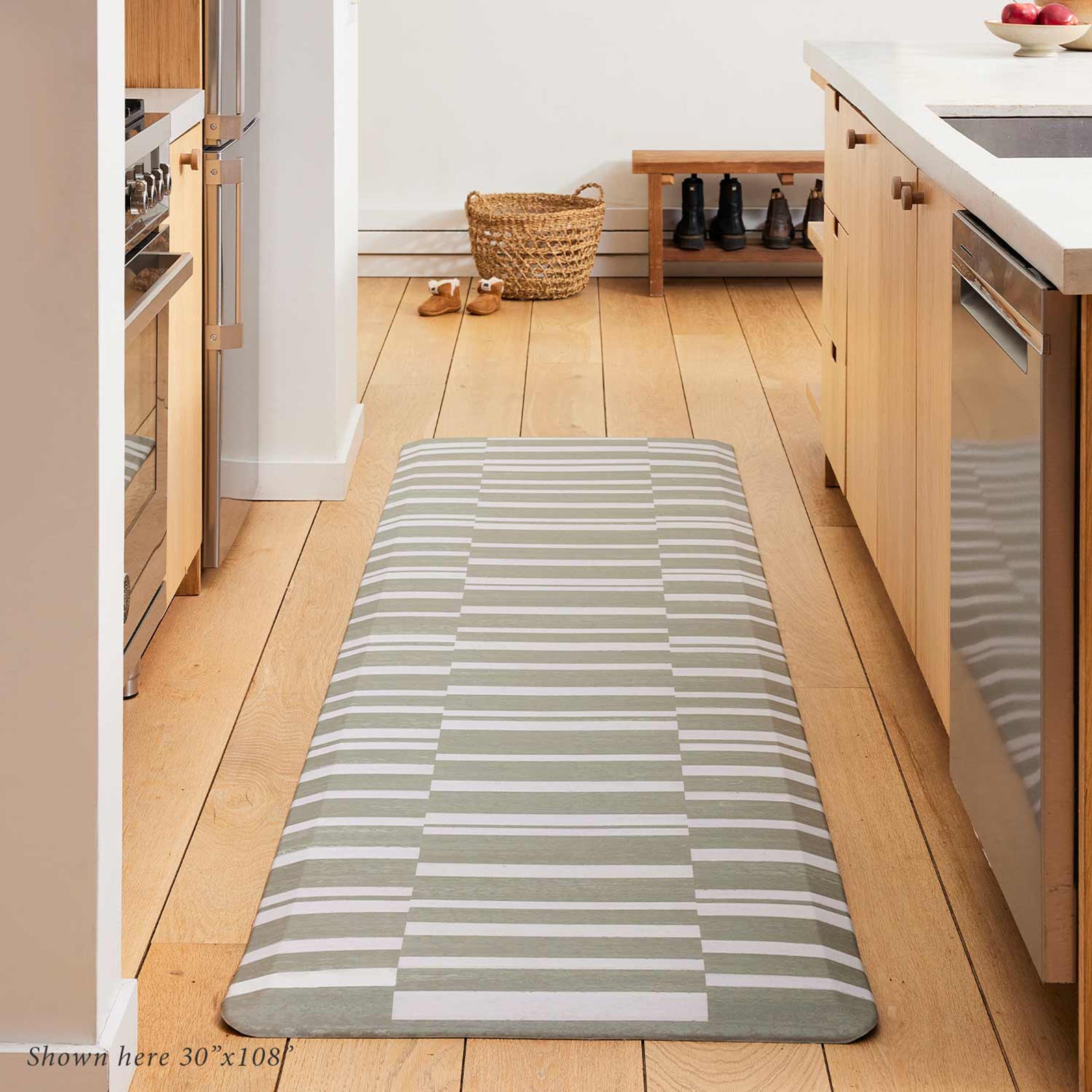 sutton stripe basil green and white inverted stripe standing mat shown in a light wood toned kitchen in size 30x108