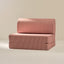 Pink striped sofa on a beige background