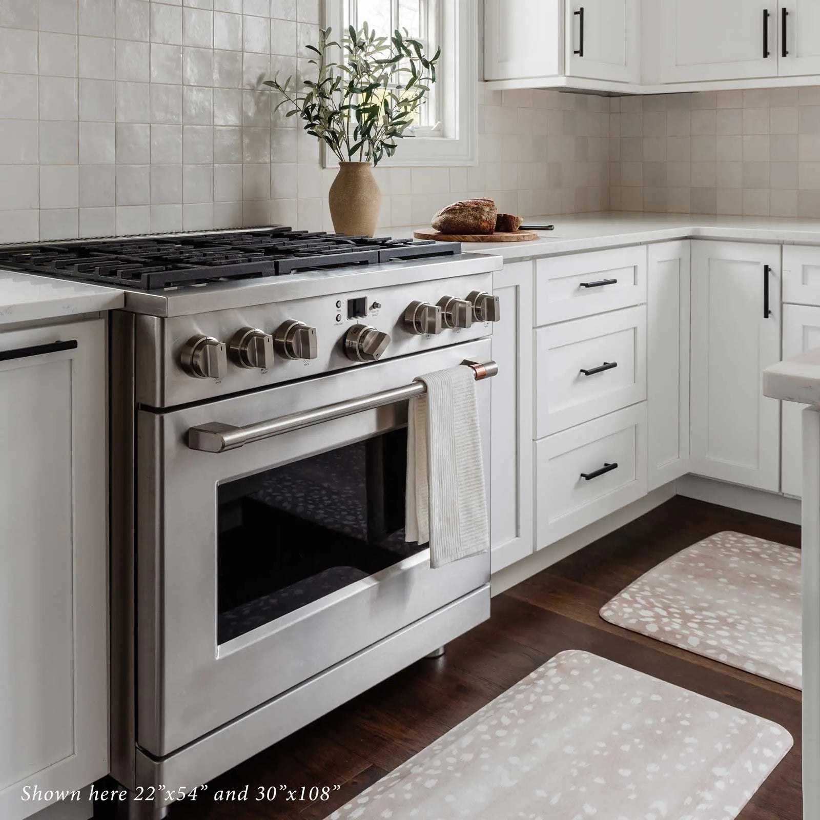 Fawn brown neutral animal print standing mat shown in kitchen in sizes 22x54 and 30x108