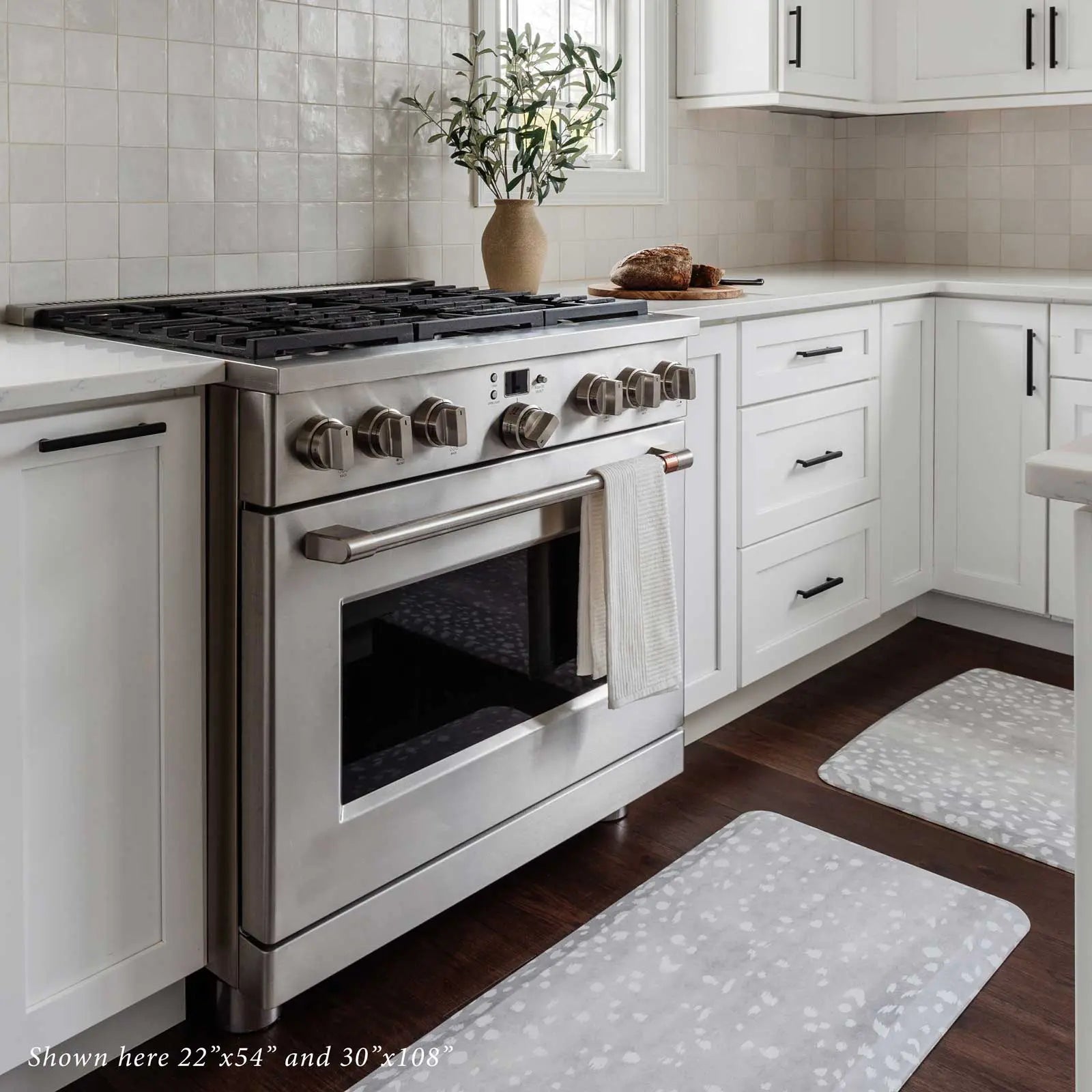 Fawn silver gray animal print standing mat shown in kitchen in front of oven in sizes 22x54 and 30x108