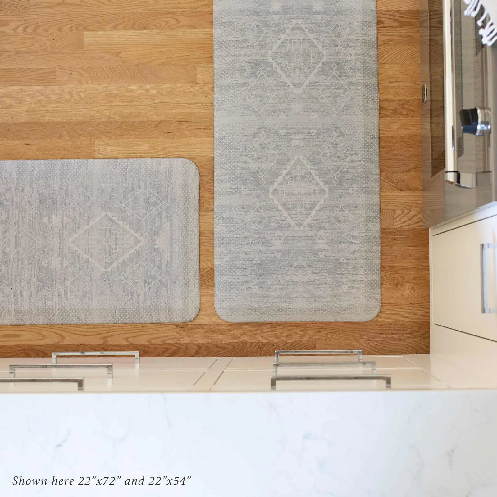 Ula gray and white Minimal Boho Pattern Standing Mat shown from above in kitchen shown in size 22x72 and 22x54