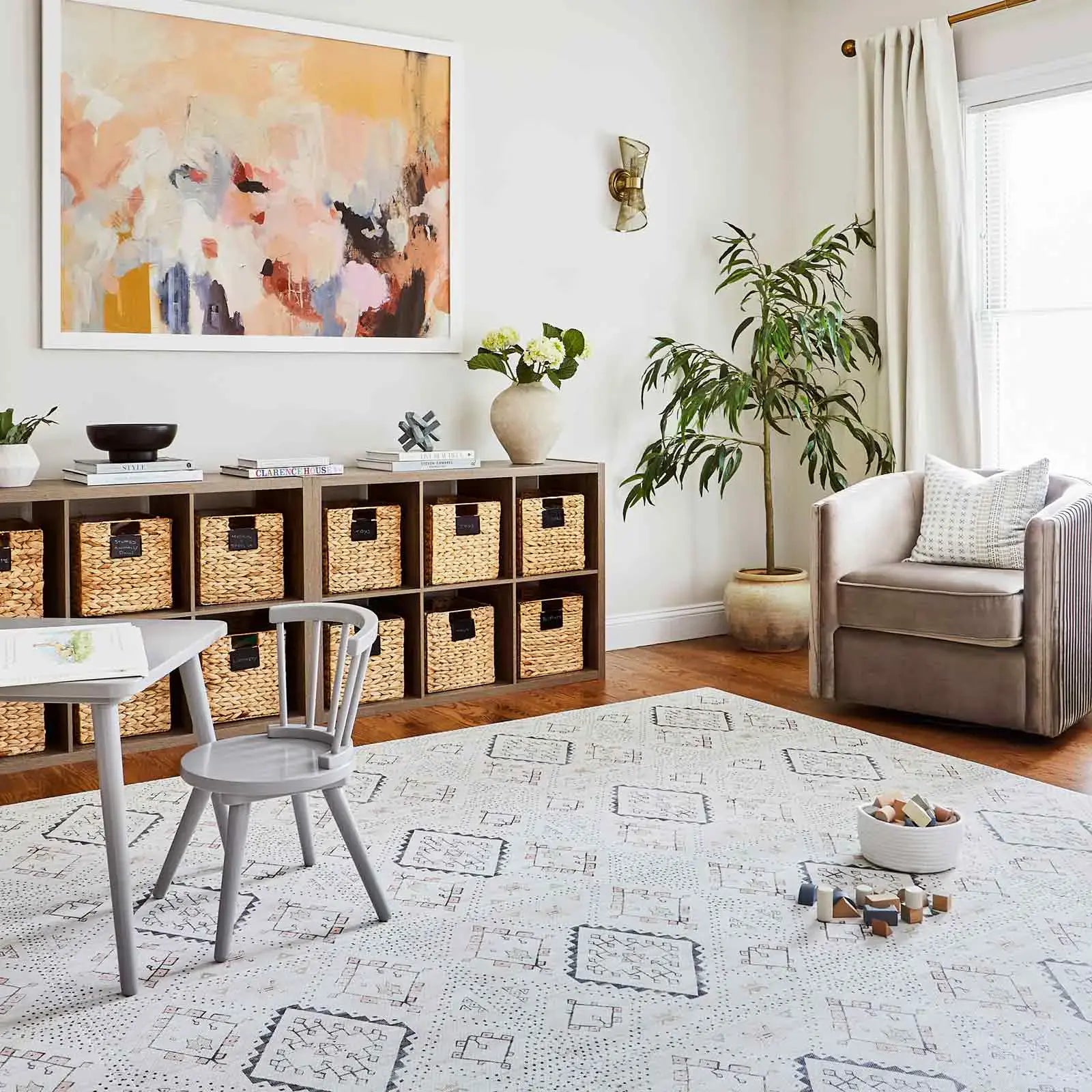 Oat Neutral Beige Minimal Boho Pattern play mat shown in a living room with play table and blocks on the mat