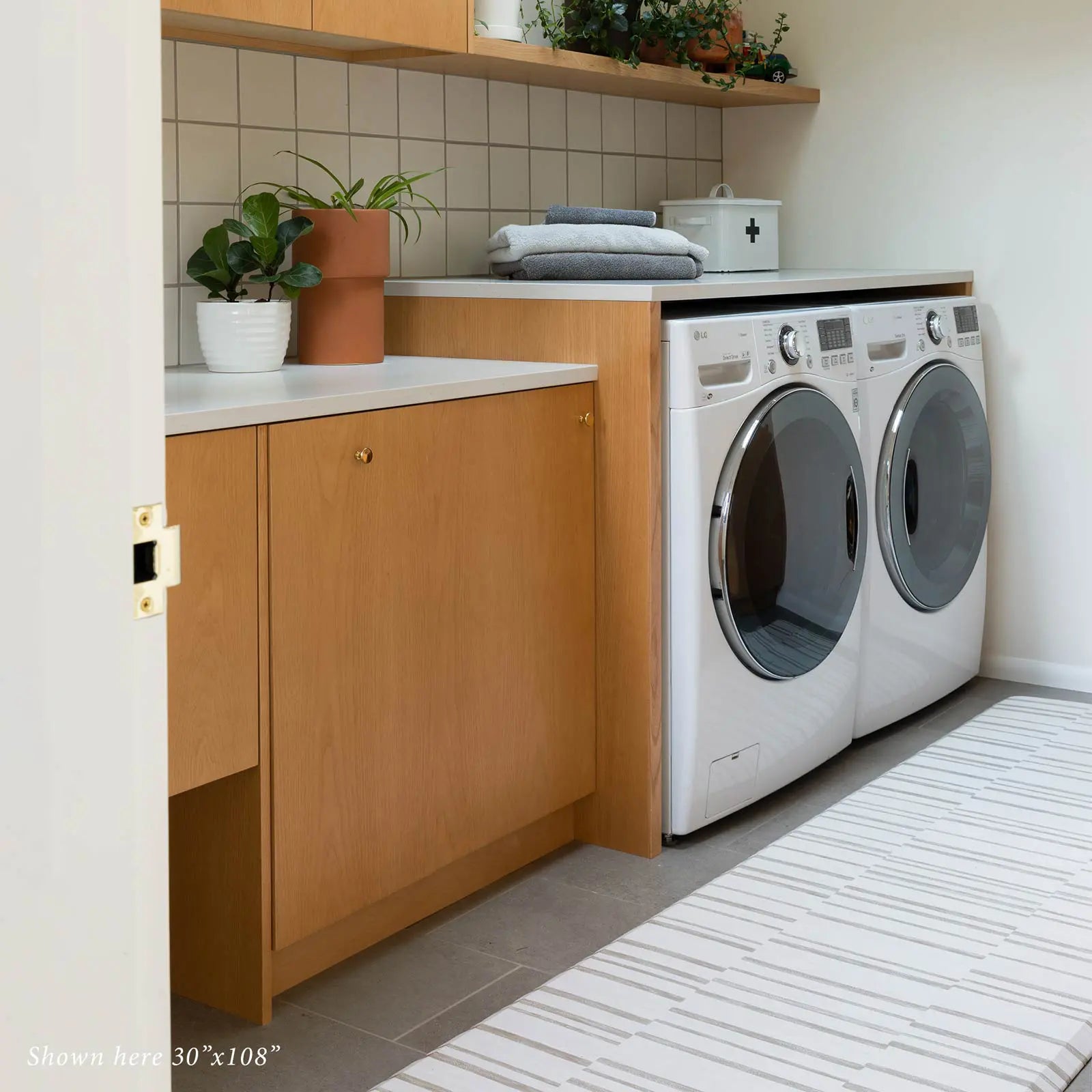 Beige inverted stripe kitchen mat in laundry room in front of washer dryer in size 30x108.