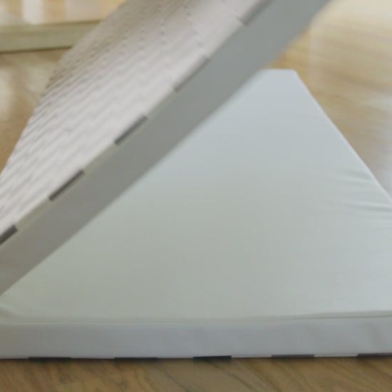 Video showing various shots of the house of noa tumbling mat being played and jumped on by toddlers