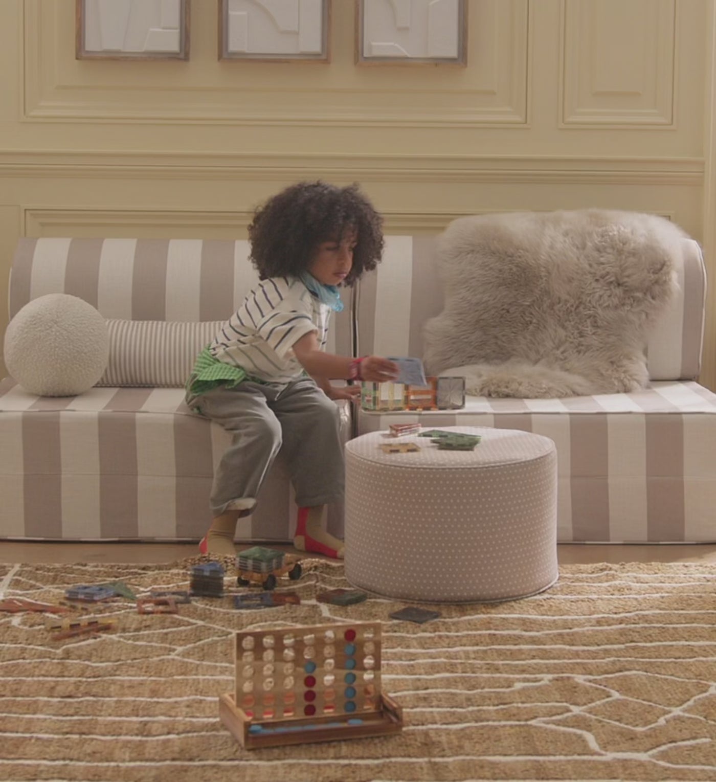 Video showing children in different playrooms enjoying toys and soft furniture made into forts 