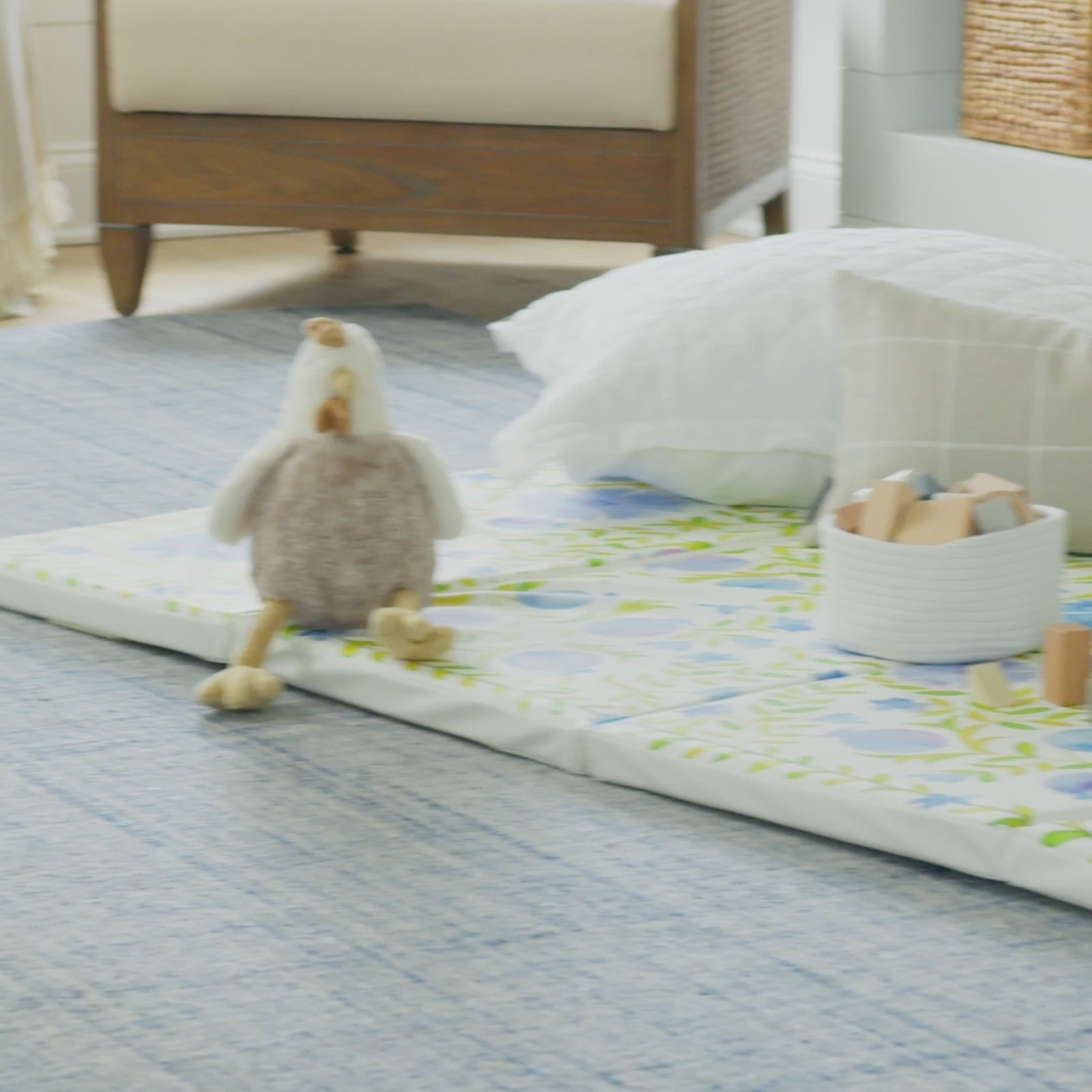 Video showing various shots of the bluebell blue white and green floral tumbling mat being played and jumped on by toddlers