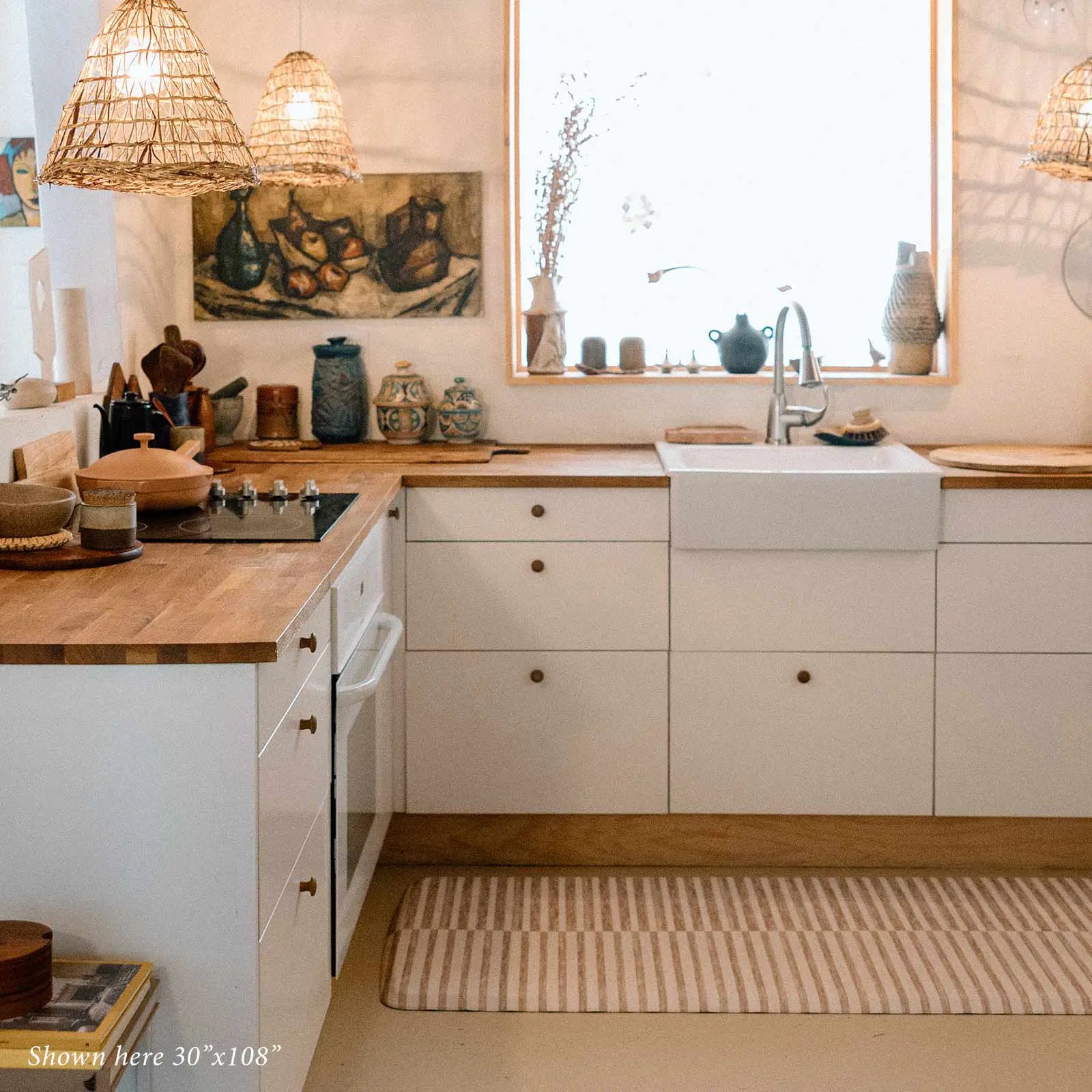 Reese chai beige and white inverted stripe standing mat shown in kitchen in size 30x108