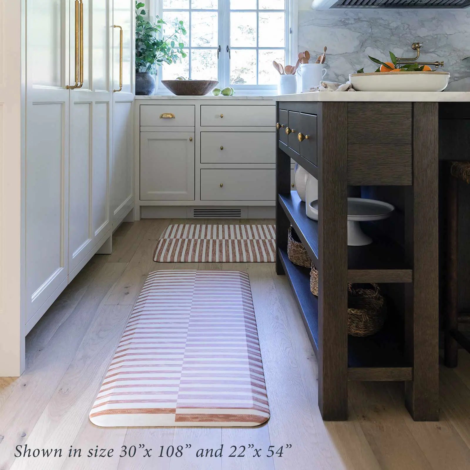 Reese terracotta brown and white inverted stripe standing mat shown in kitchen in sizes 22x54 and 30x108