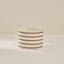Striped fabric basket on a beige background
