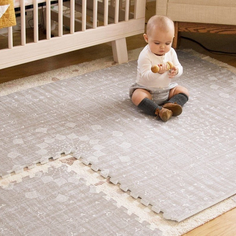 Sand Castle beige play mat with baby playing
