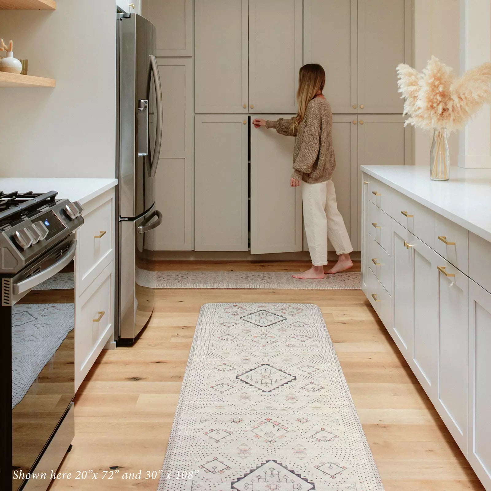 Oat Neutral Beige Minimal Boho Pattern Standing Mat in kitchen with woman shown in size 20x72 and 30x108