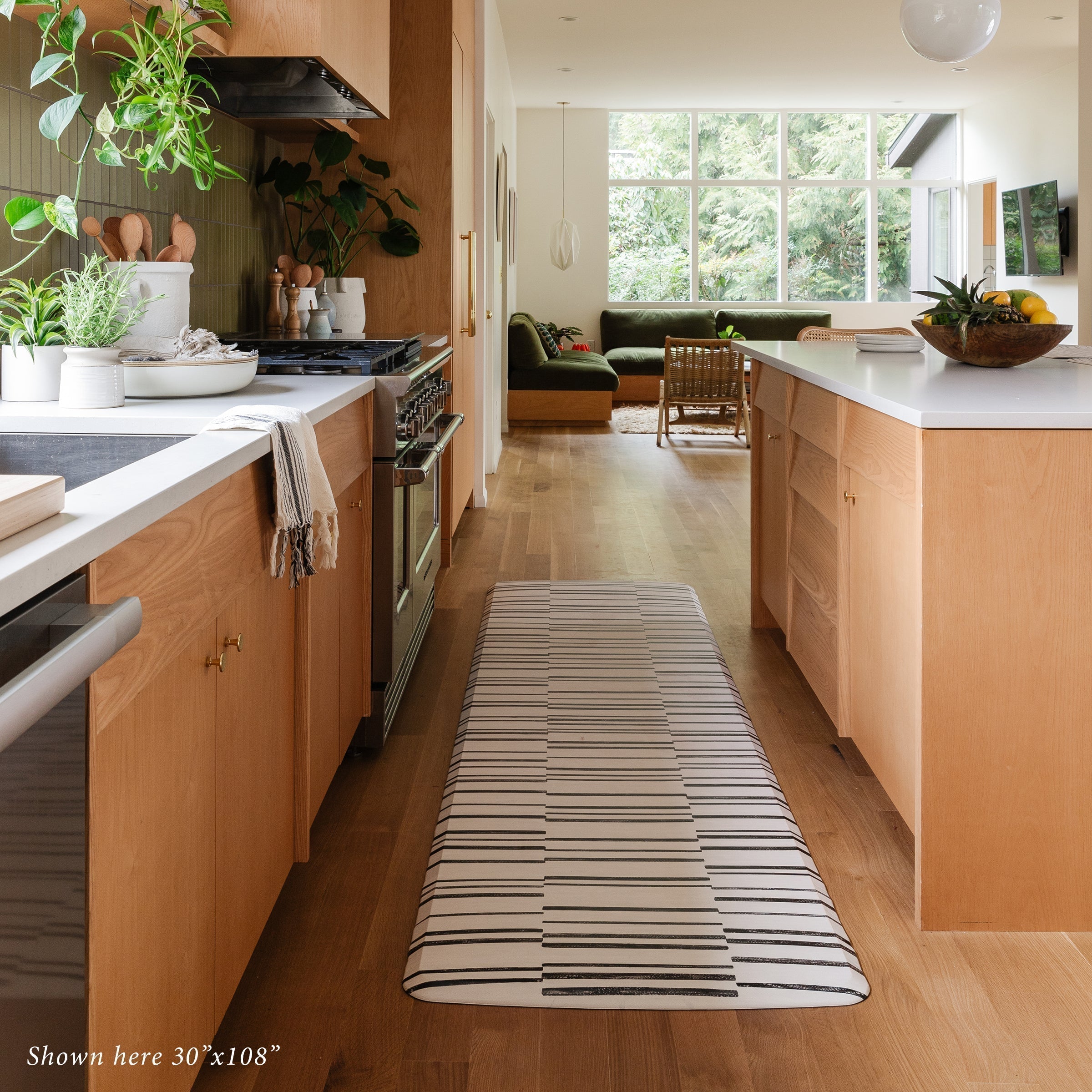 Black and White Minimal Inverted Stripe Print Standing Mat in kitchen in size 30x108
