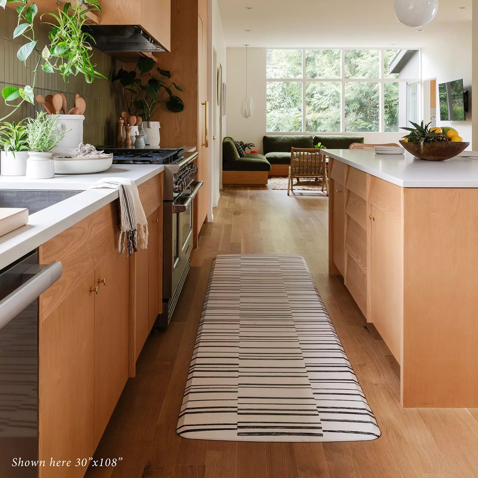 Black and white inverted stripe kitchen mat in size 30x108 in kitchen