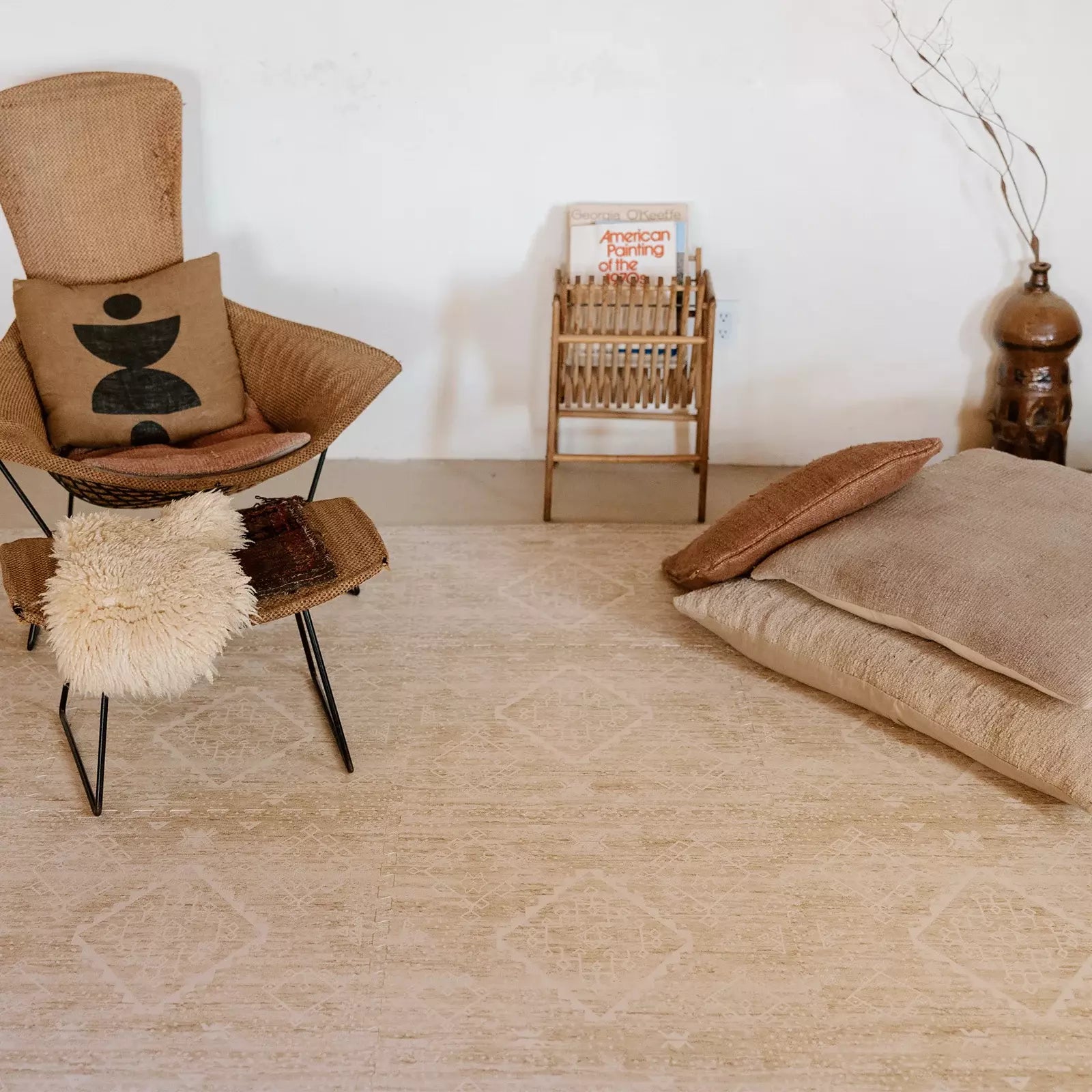 Ula Straw neutral tan minimal boho pattern play mat shown in living room
