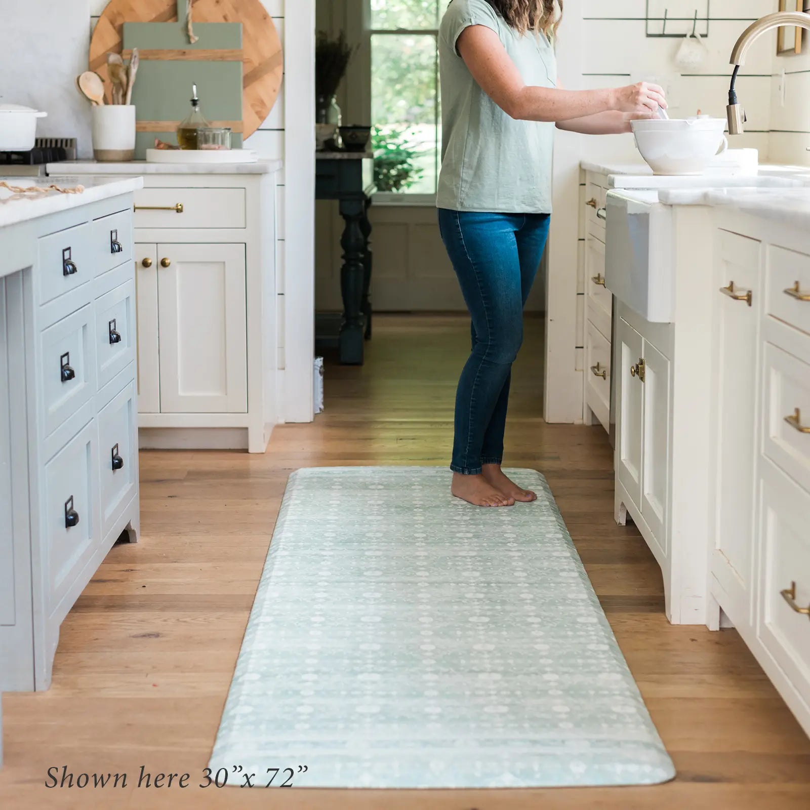 Nama standing mat Gemma white sage green floral in front of kitchen sink with woman shown in size size 30x72