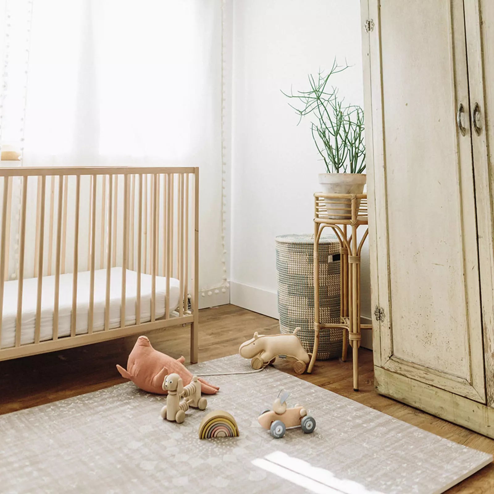 Sand Castle beige play mat in nursery