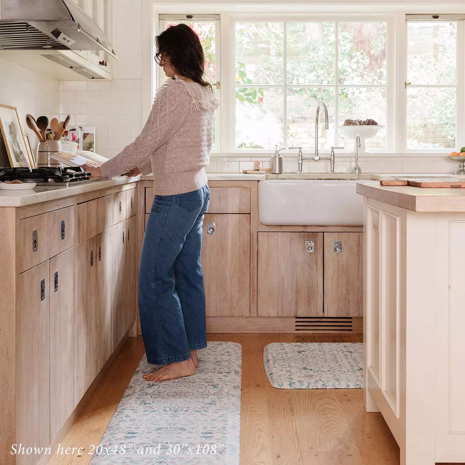 Emile Pale Aqua Muted Blue Pink Floral Boho Standing Mat with woman in kitchen shown in size 20x48 and 30x108