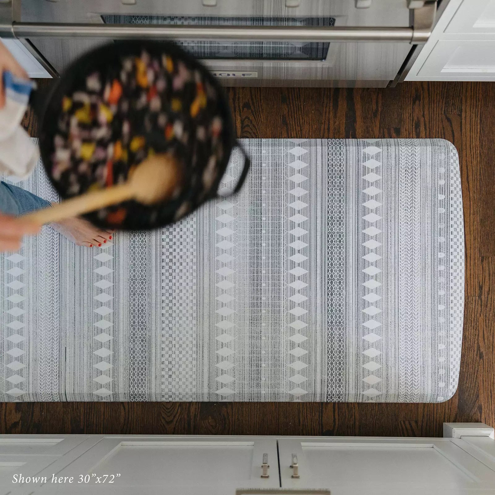 Nordique Fog Gray and White Boho Nordic Print Standing Mat in kitchen with woman cooking pictured from above