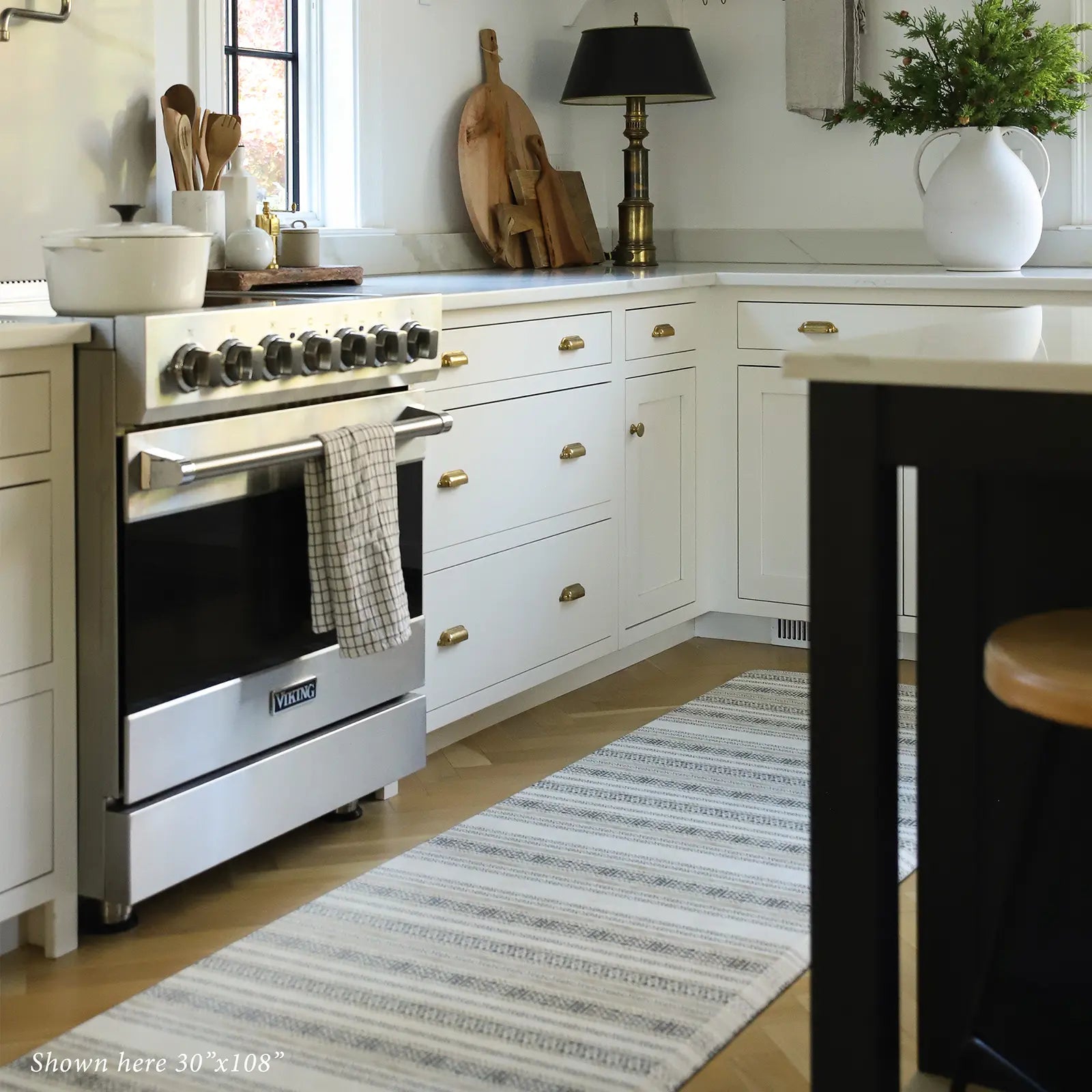 Tan and black neutral boho stripe kitchen mat shown in kitchen in size 30x108